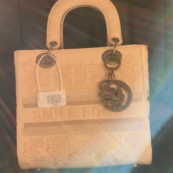 Handbags - Embossed Cream Tote Bag with Charm